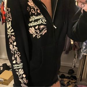 Black beautiful disaster zip up. Never worn.